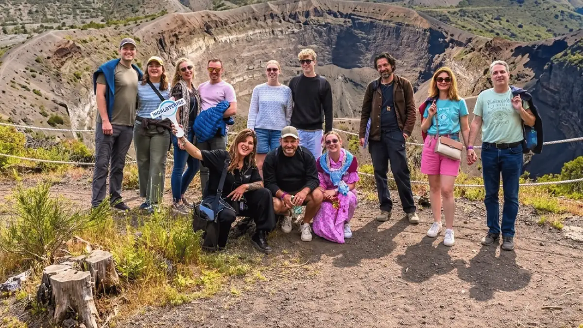 Small group walking a lava-rock trail on Mount Vesuvius on a small group Pompeii and Vesuvius tour from Naples, Italy